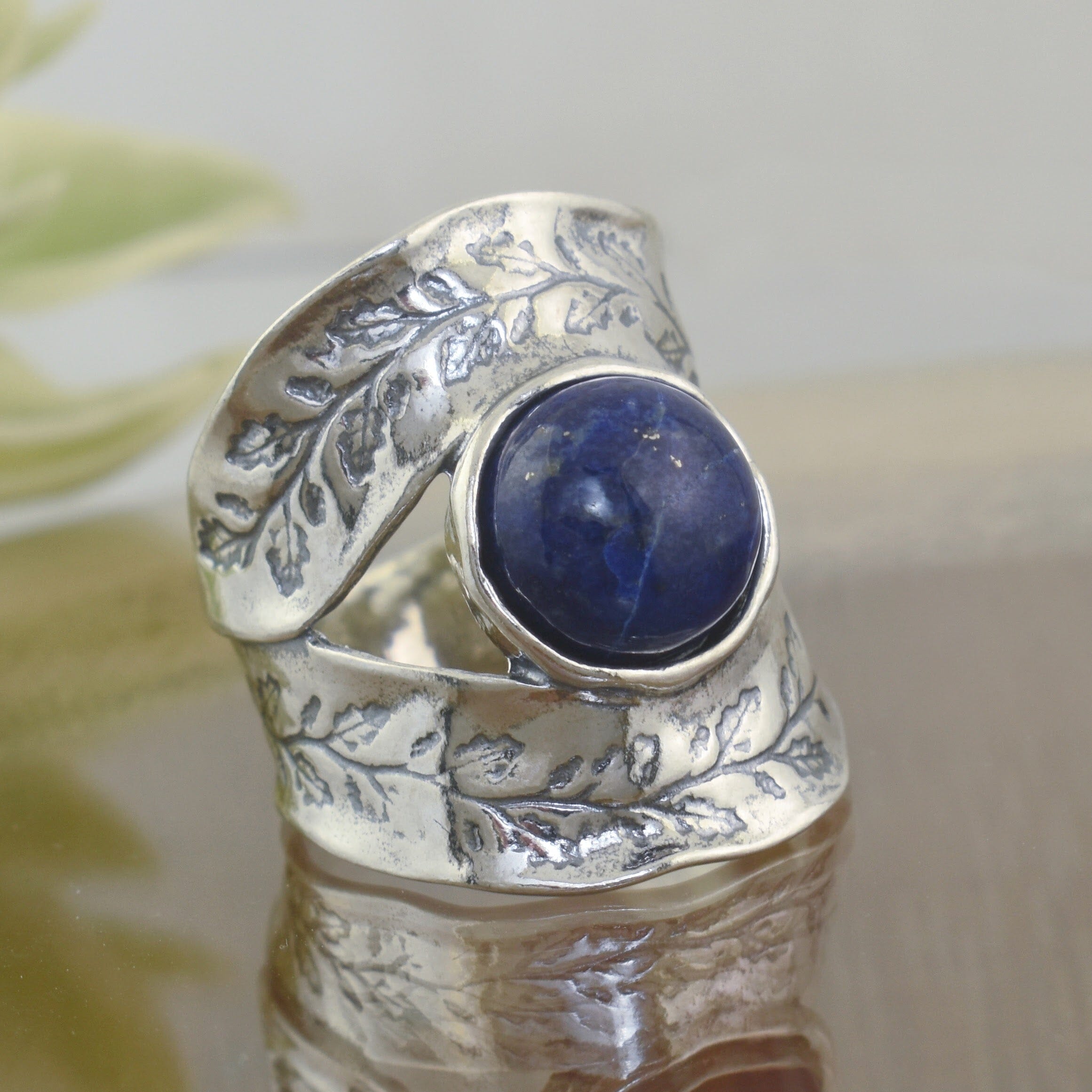 wide lapis ring with ivy details on the band