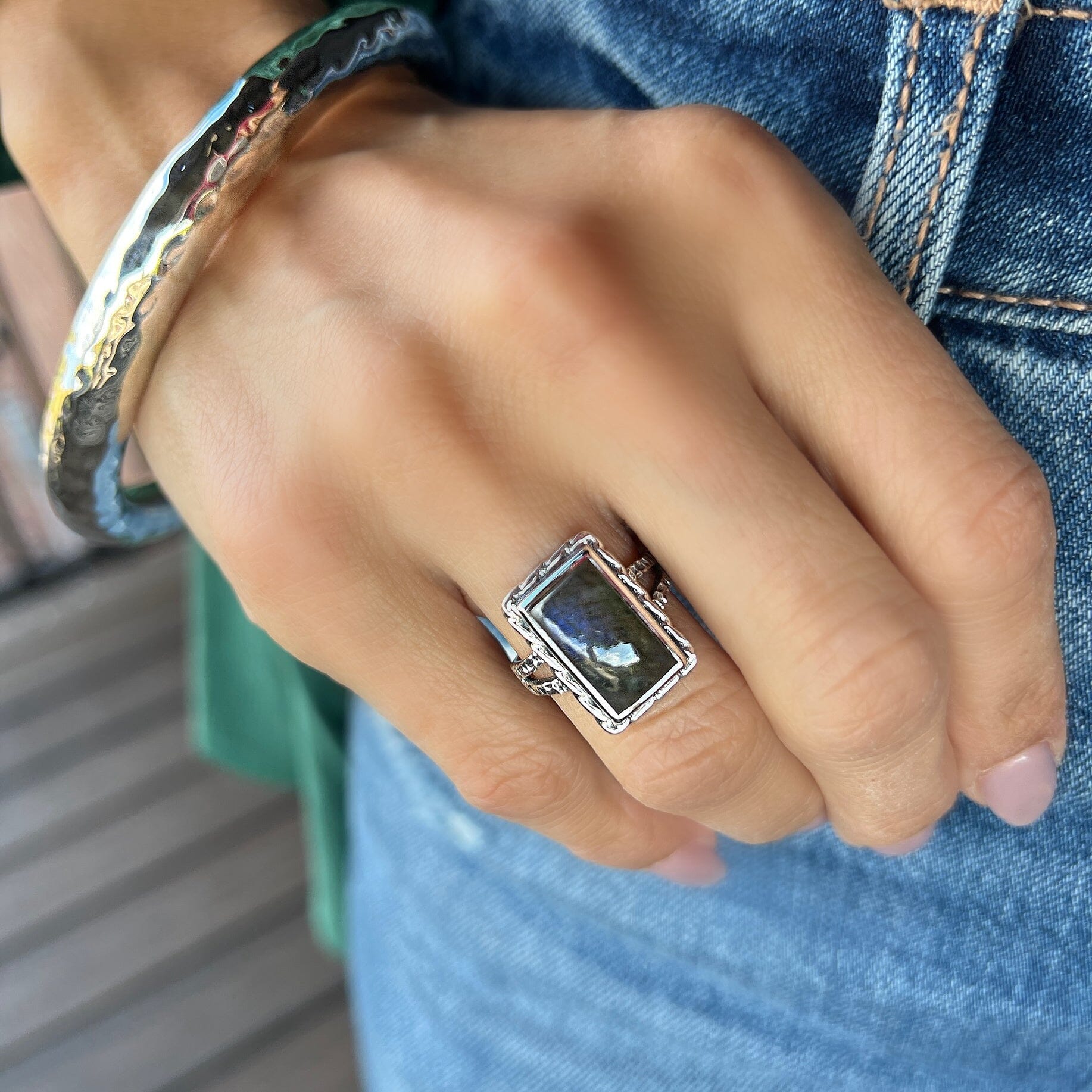 sterling silver ring with a braided setting and a hammered band