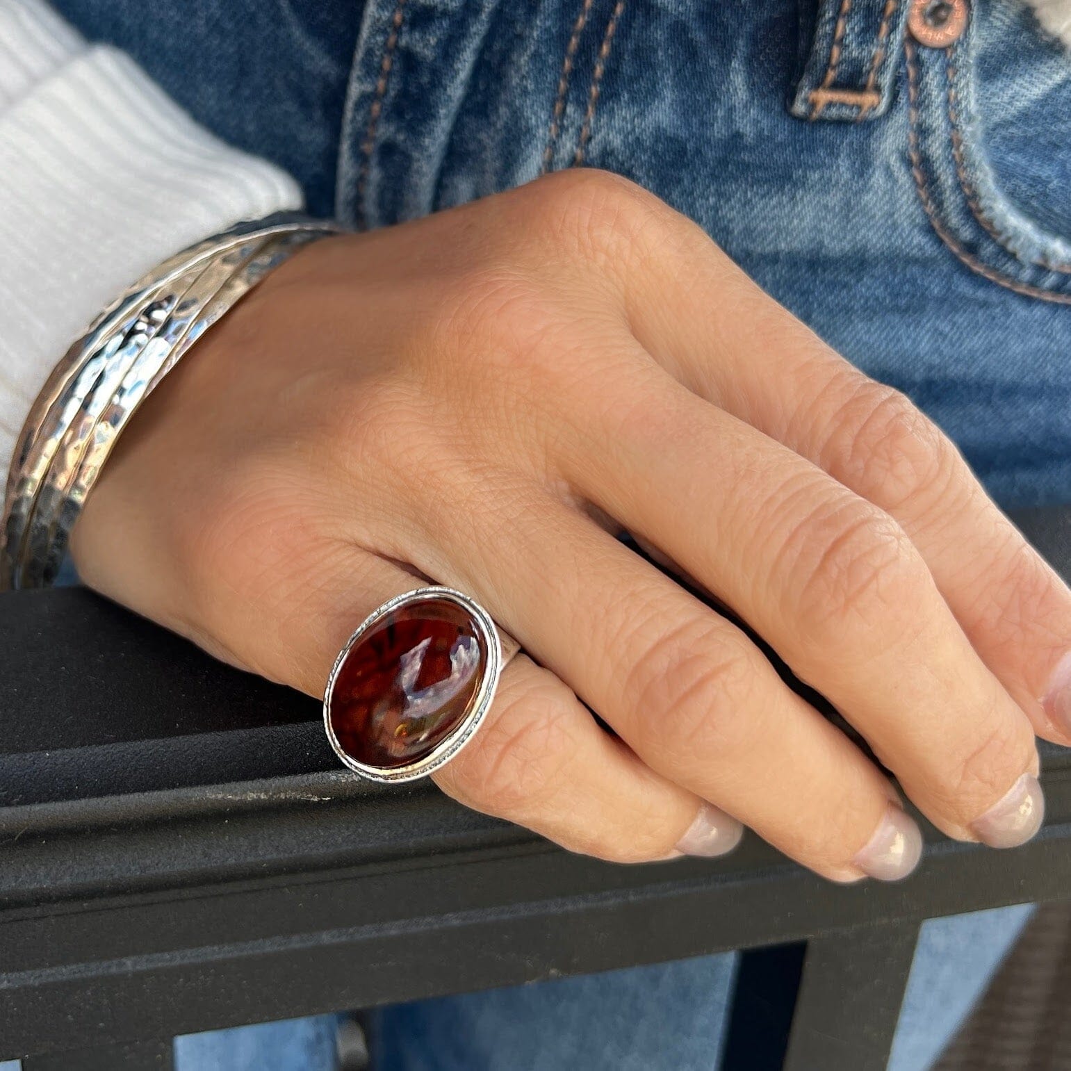 chunky silver pinky ring with oval amber center stone