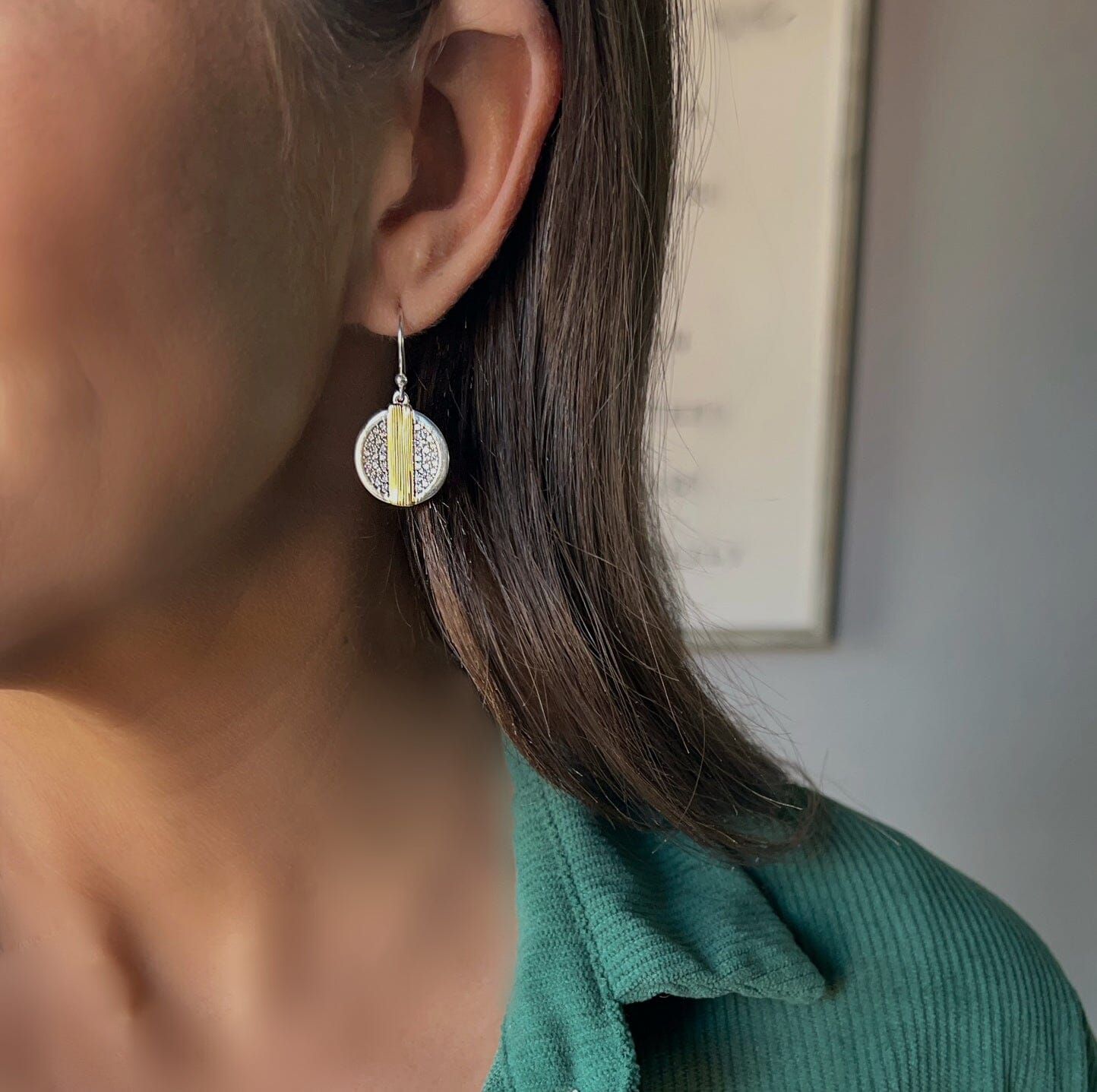 sterling silver earrings with a gold band running down the center