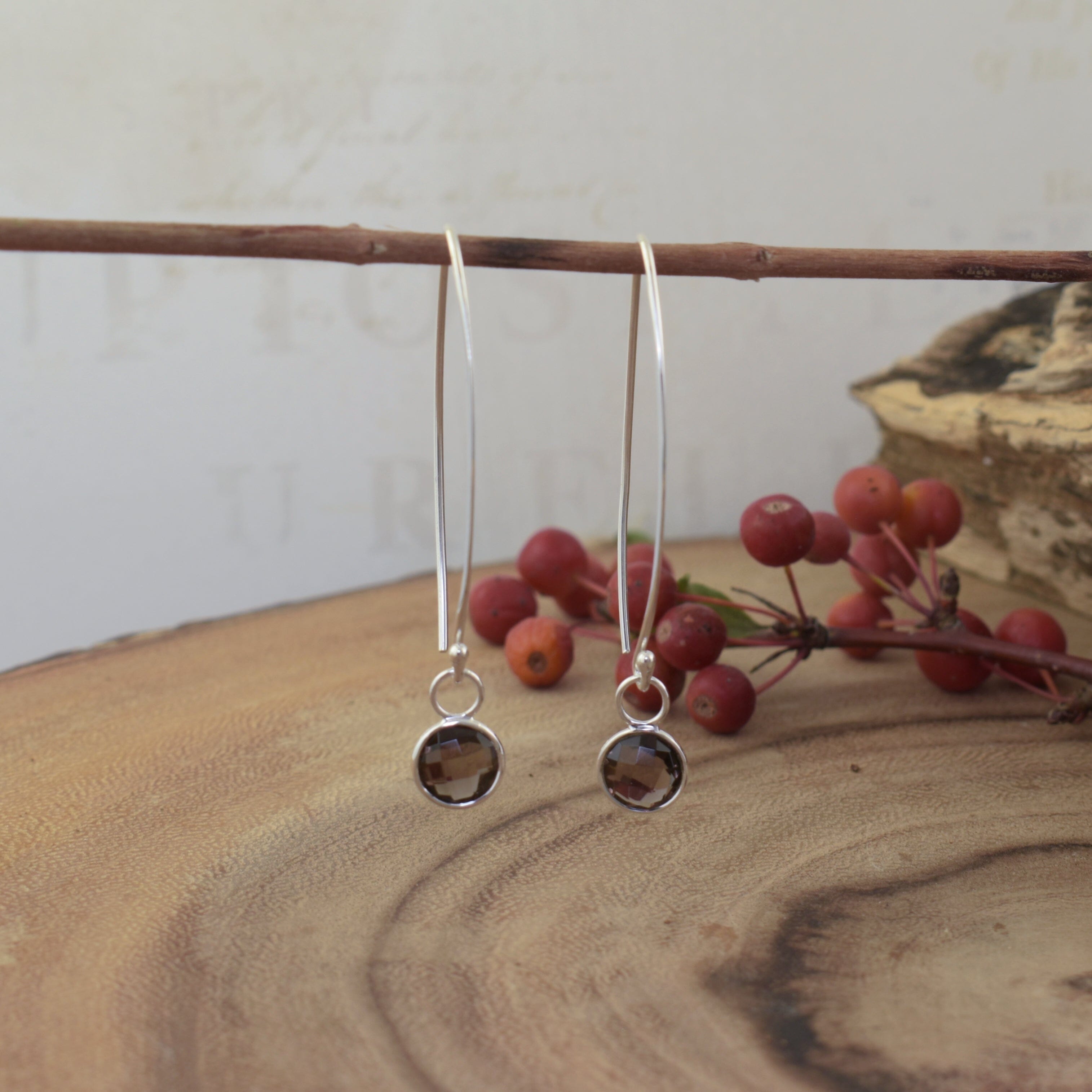 elongated earrings in sterling silver featuring bezel set smoky quartz