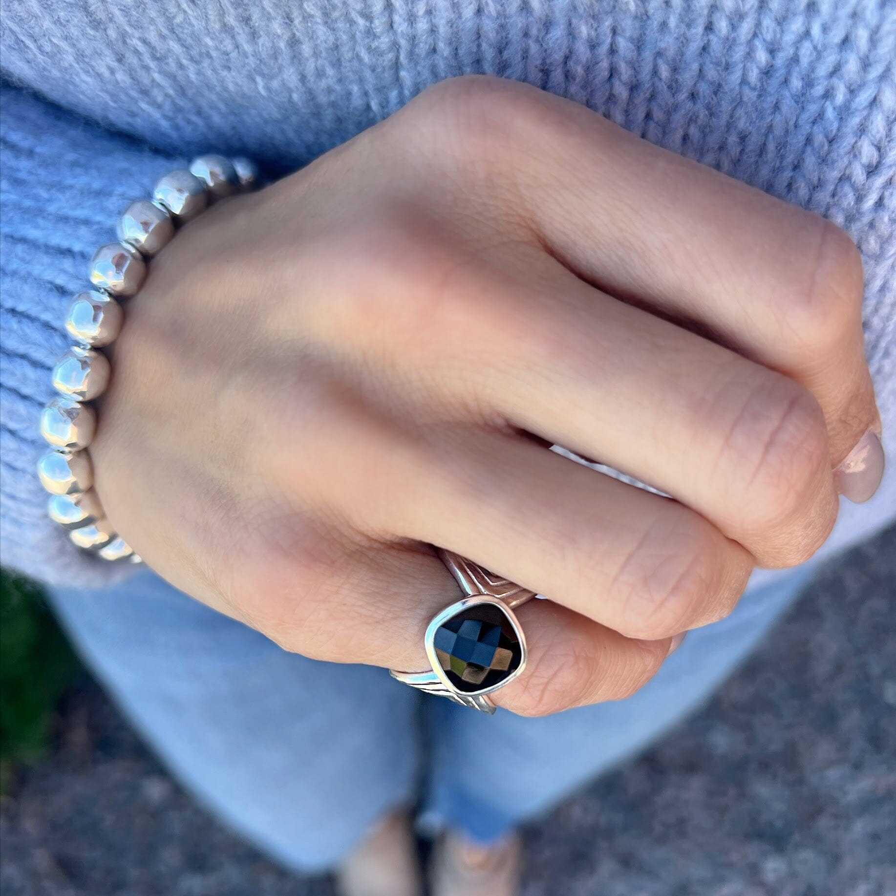 black onyx pinky ring with unique silver band