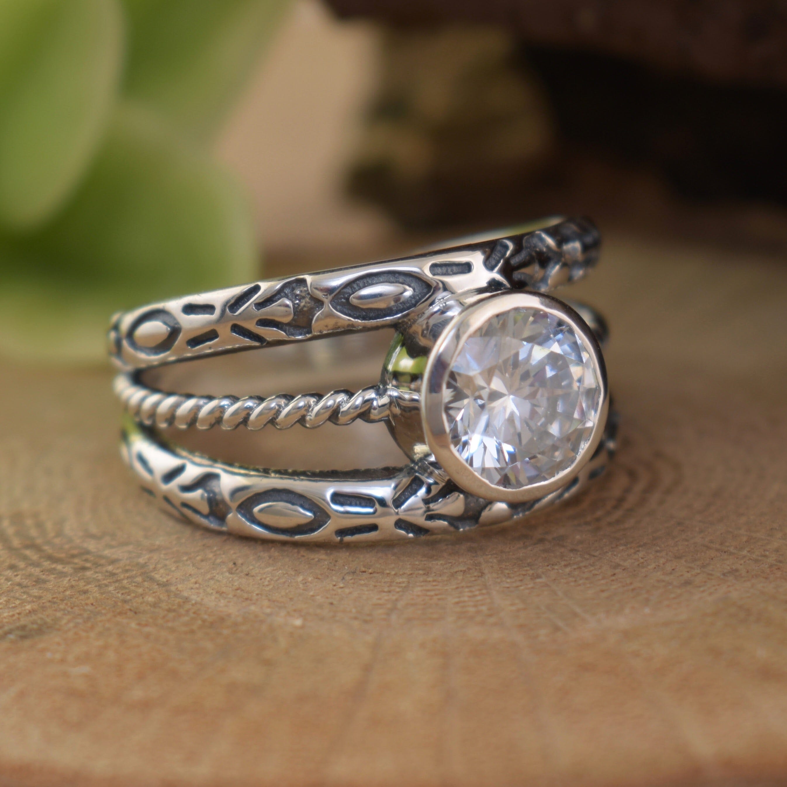 .925 sterling silver designer-inspired ring featuring round cz stone