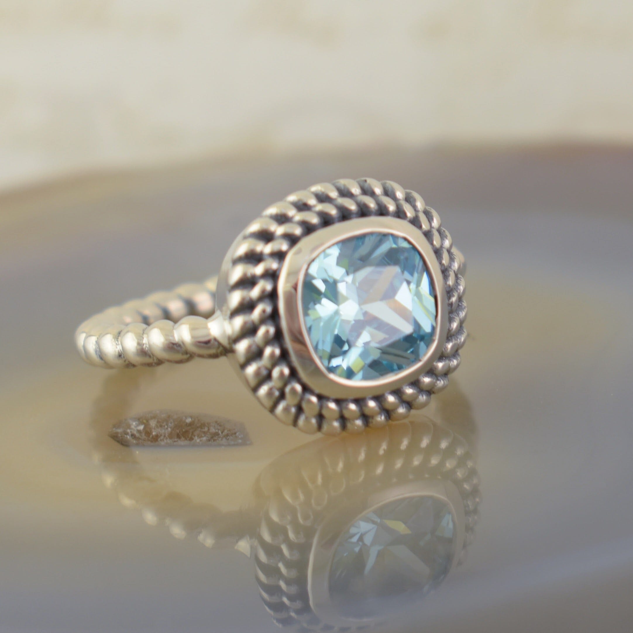 Blue stone ring set in twisted sterling silver band