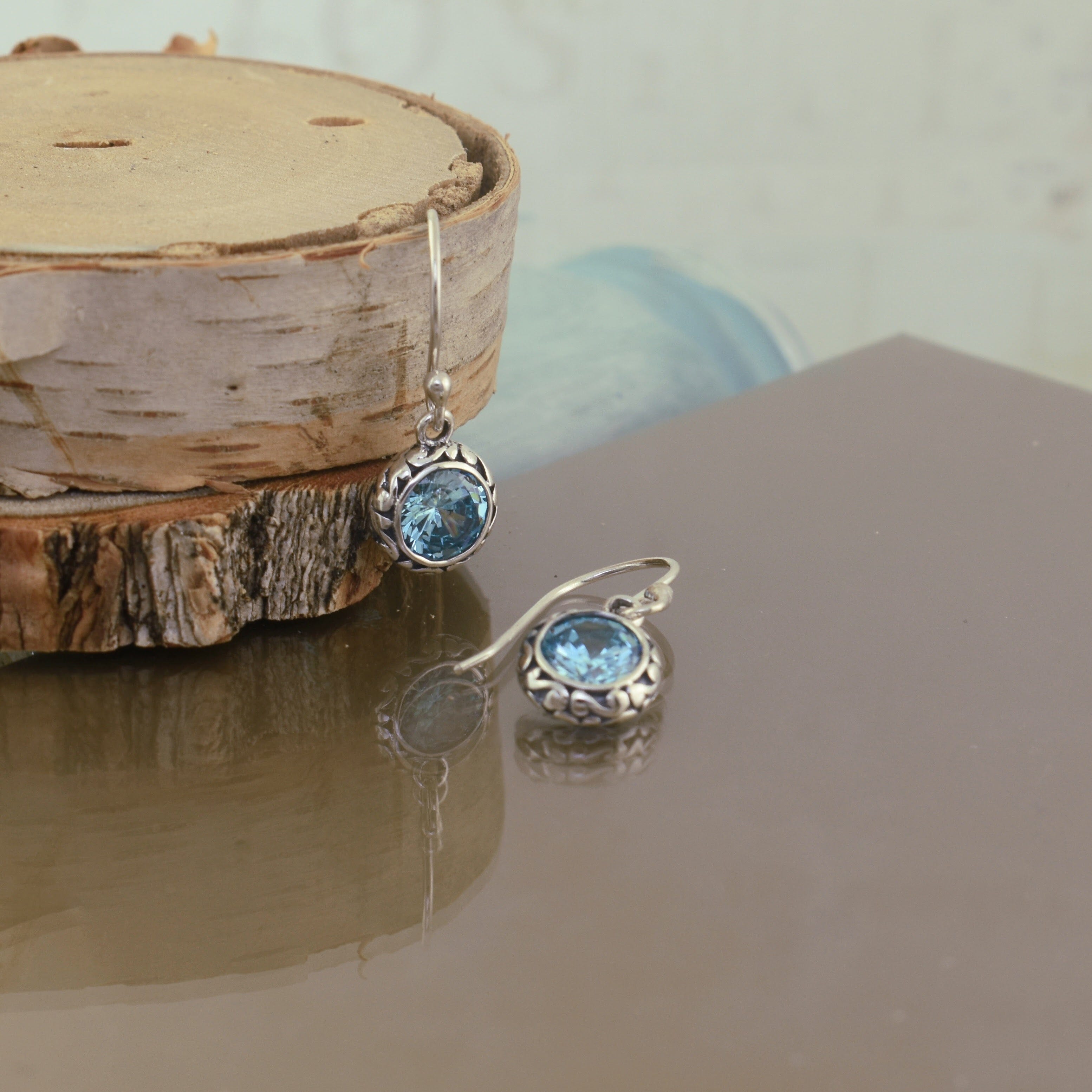 Blue stone earrings set in .925 sterling silver on French hooks