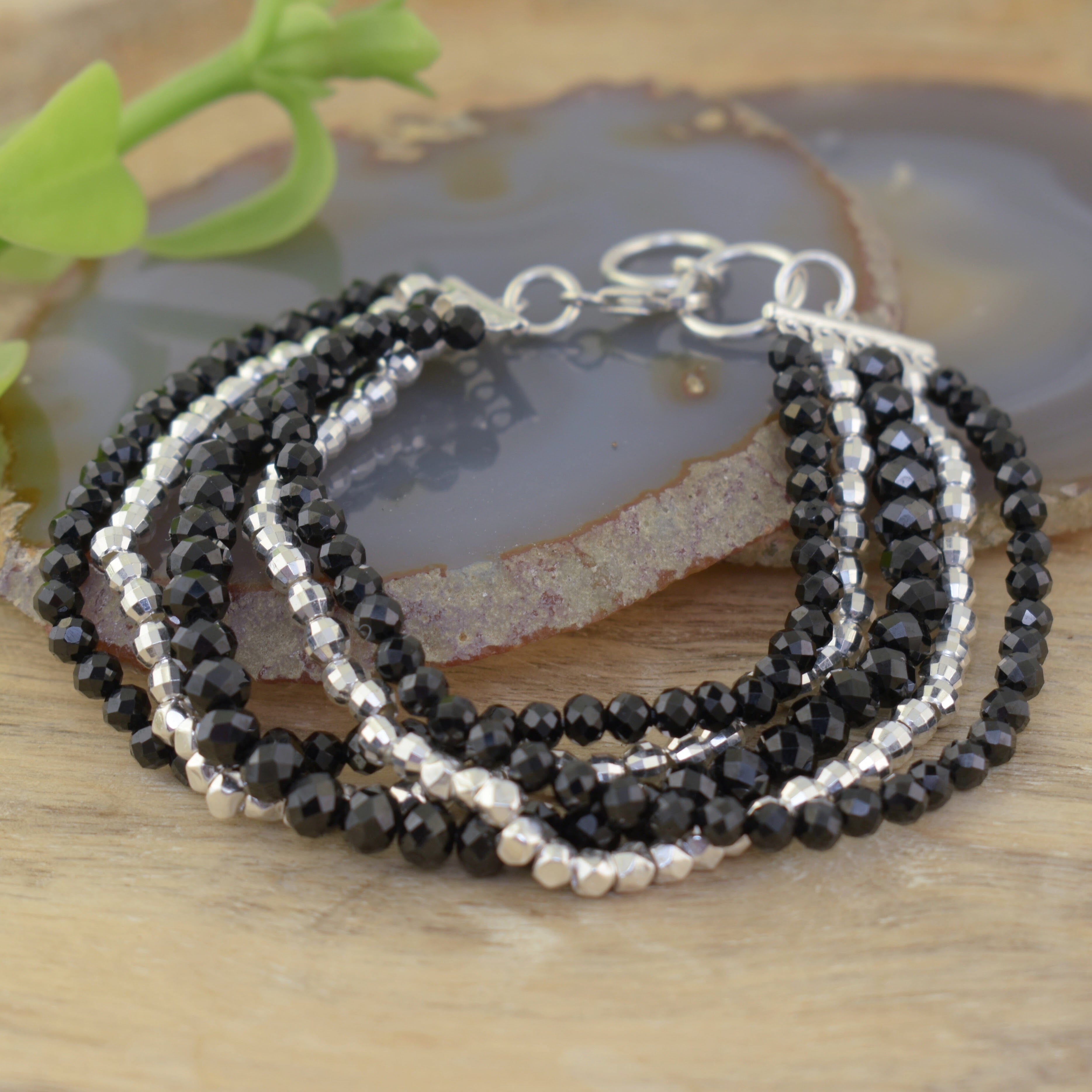 five strand bracelet featuring sterling silver, onyx, and spinel beads