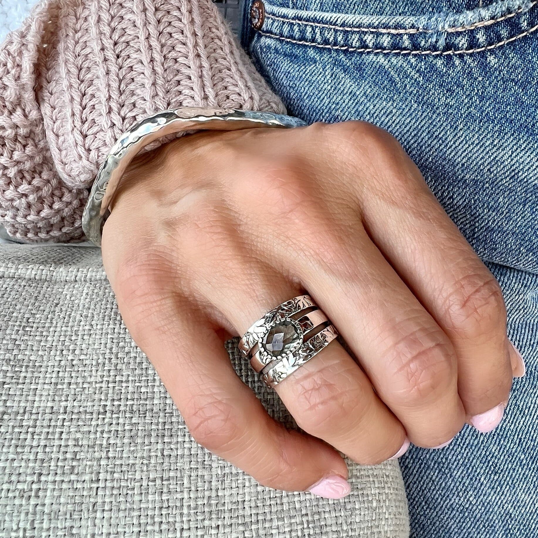 green amethyst ring with a tropical leaf design