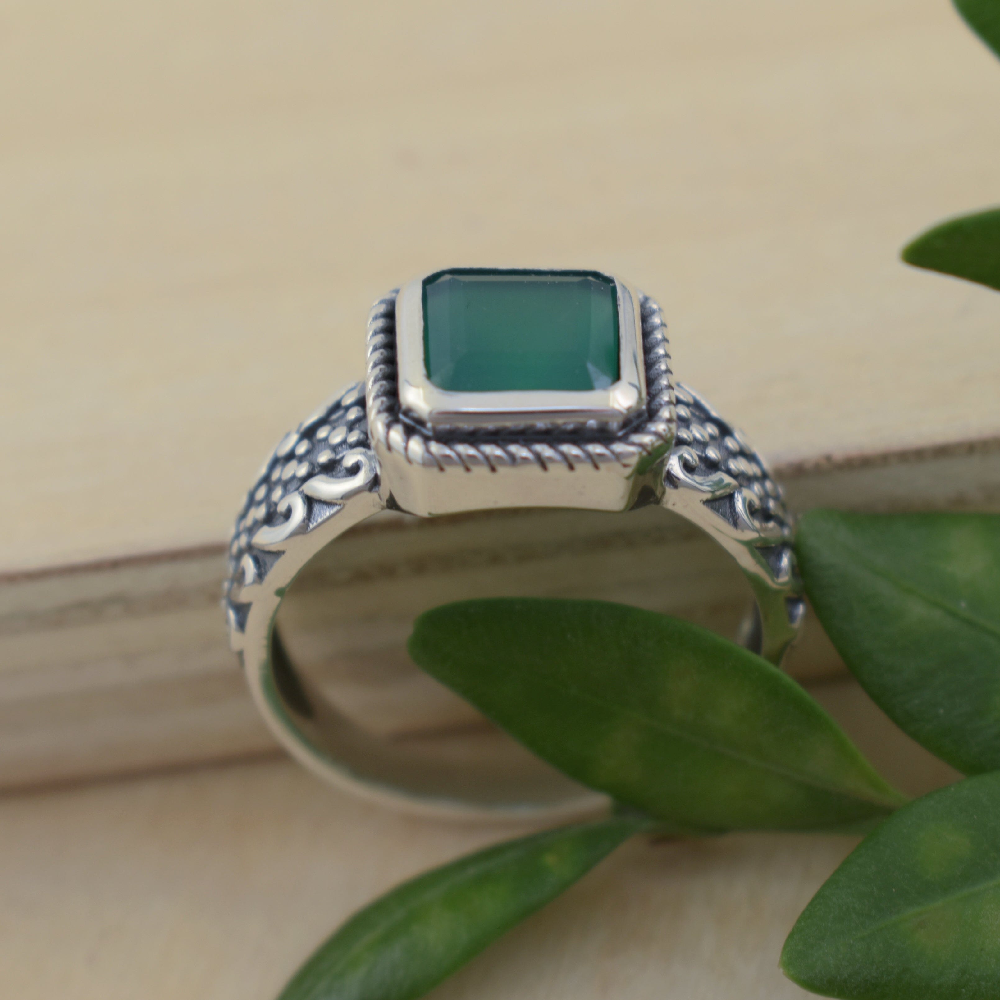 square green onyx stone bezel set in sterling silver with a twist design frame