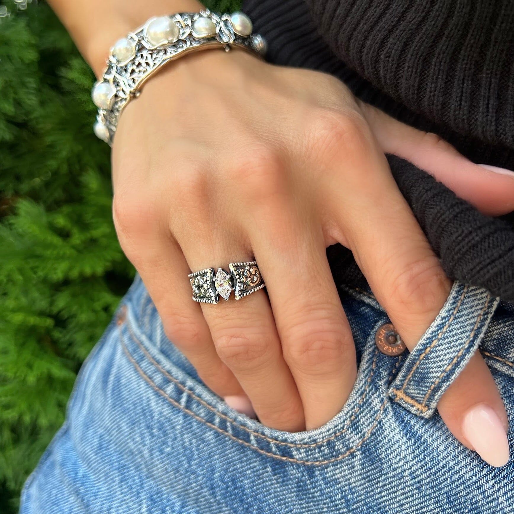 oval cut cubic zirconium ring, flower sterling silver band .925. paired with fabulous bracelet