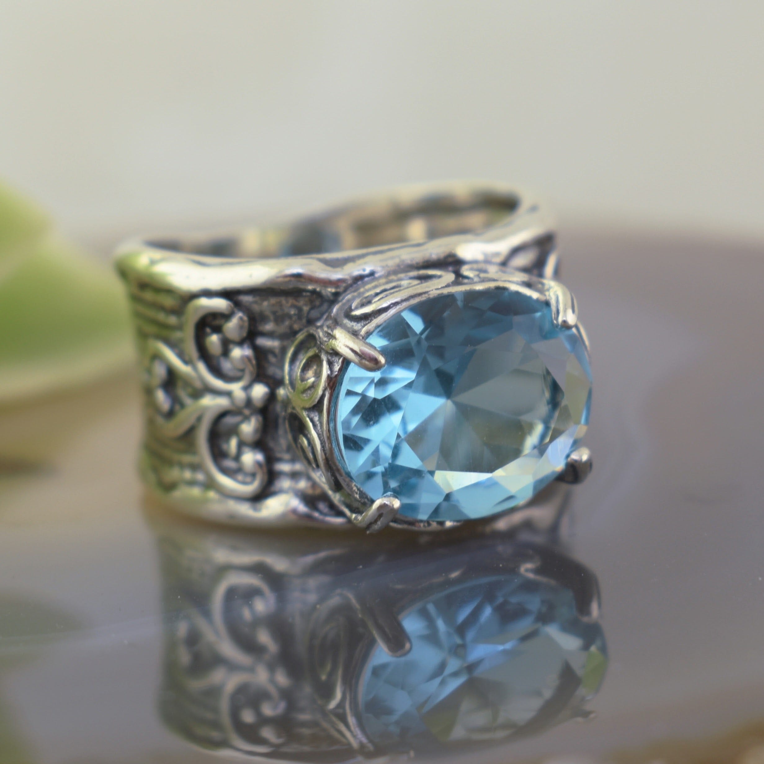 Chunky sterling silver ring with bright blue aqua stone