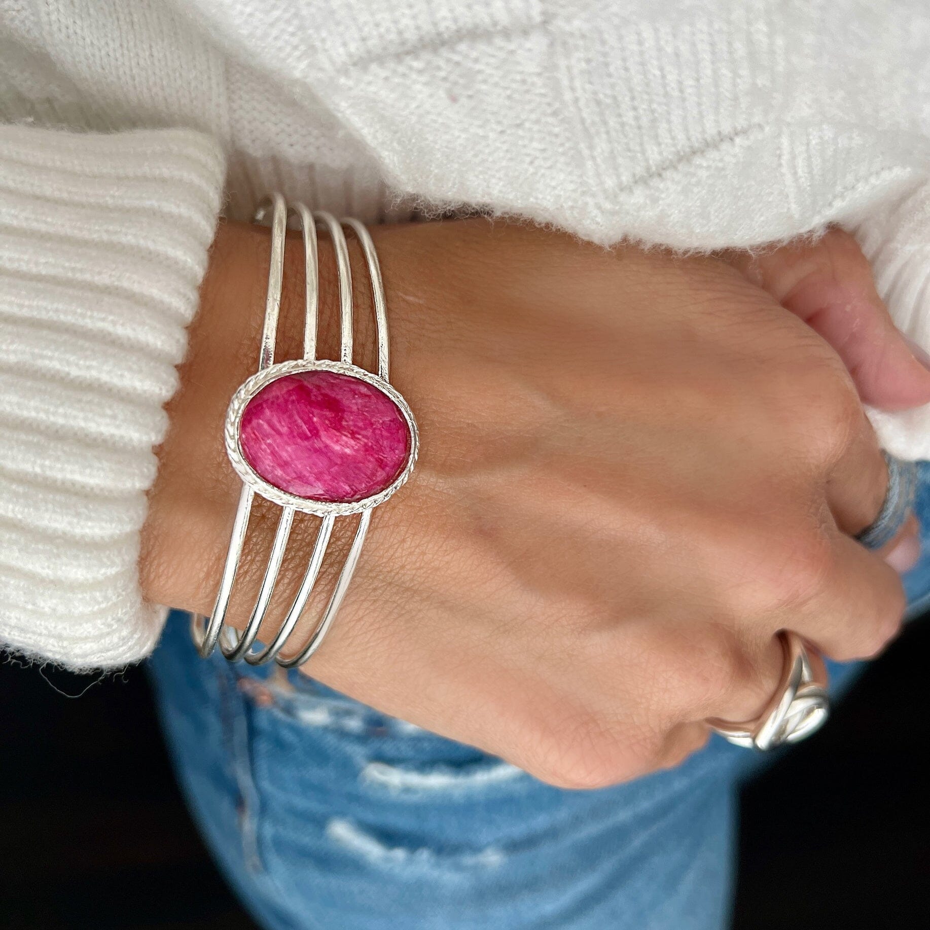 Hand crafted sterling silver cuff featuring a dyed ruby in the center.