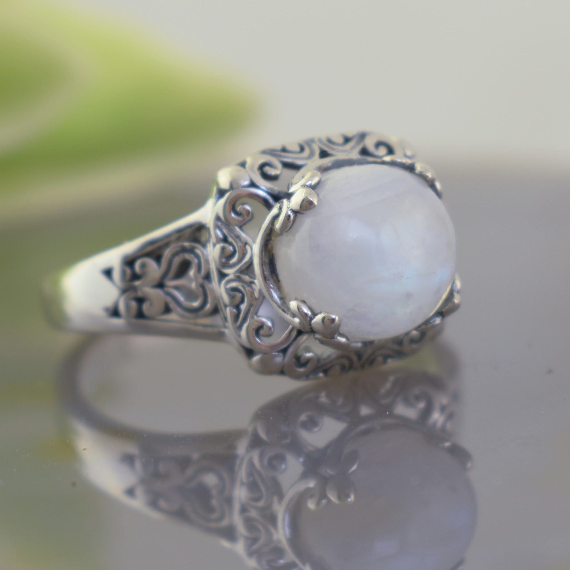 Vintage-inspired sterling silver ring with round rainbow moonstone