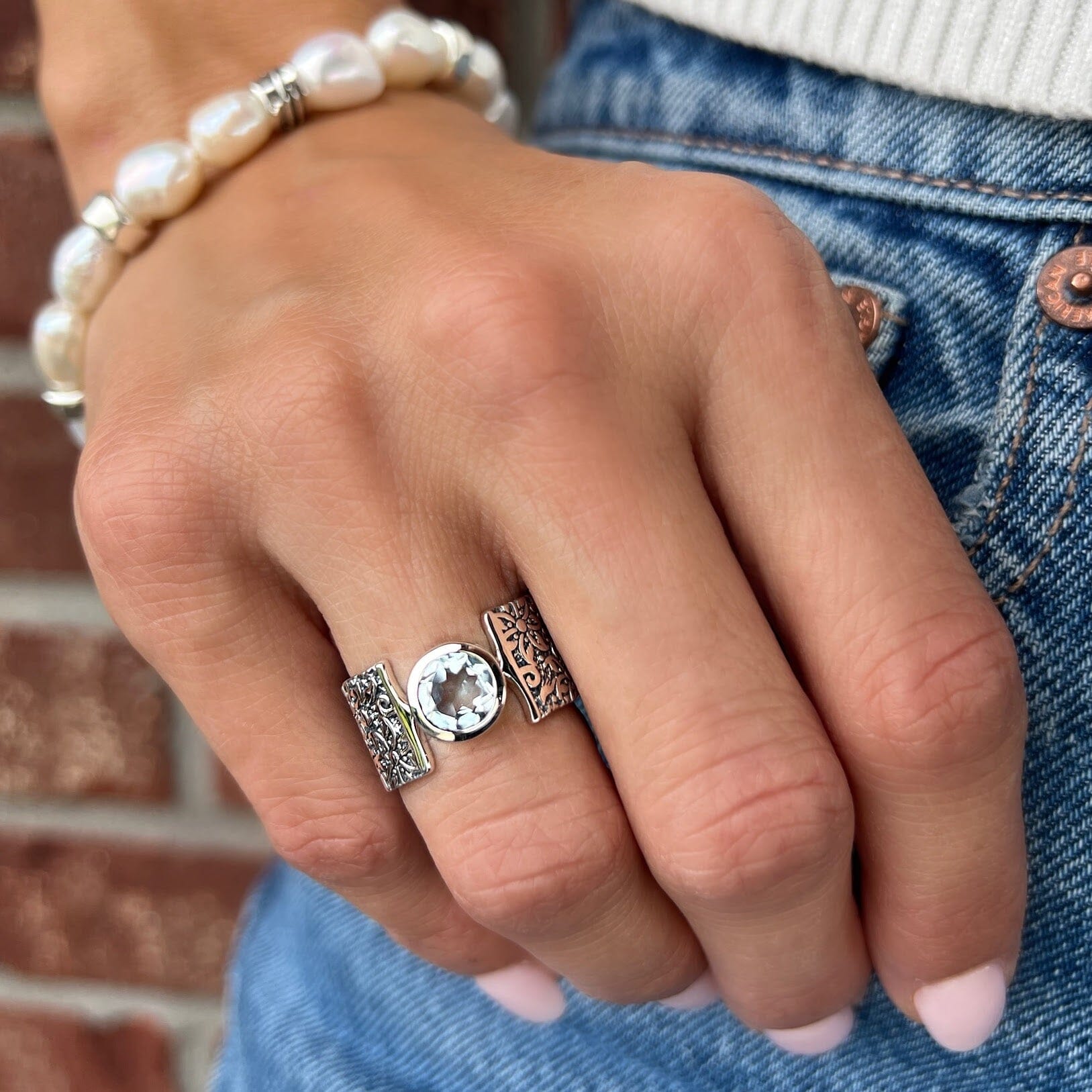 faceted blue topaz bezel set in handcrafted sterling silver