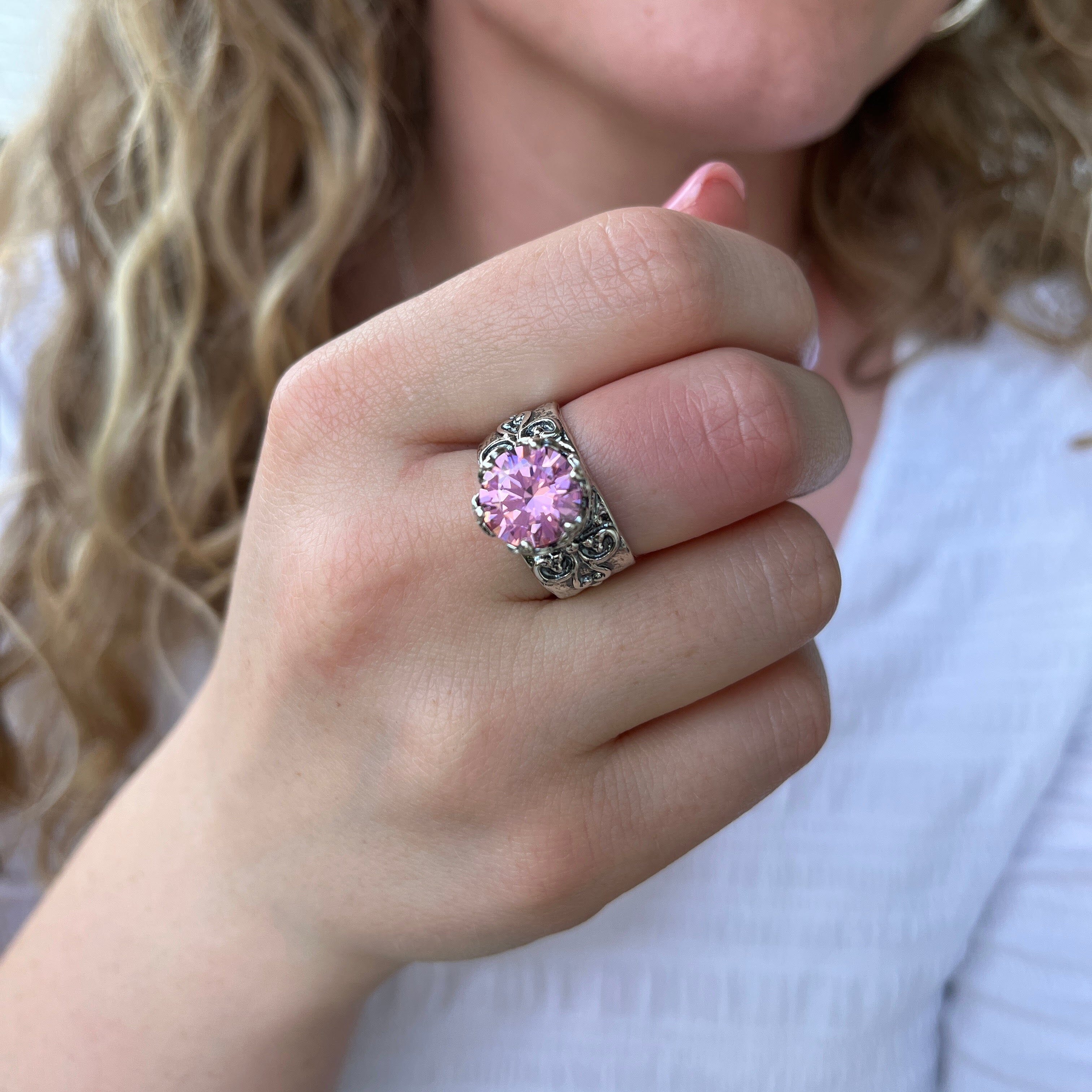 sterling silver ring with a pink cubic zirconium stone