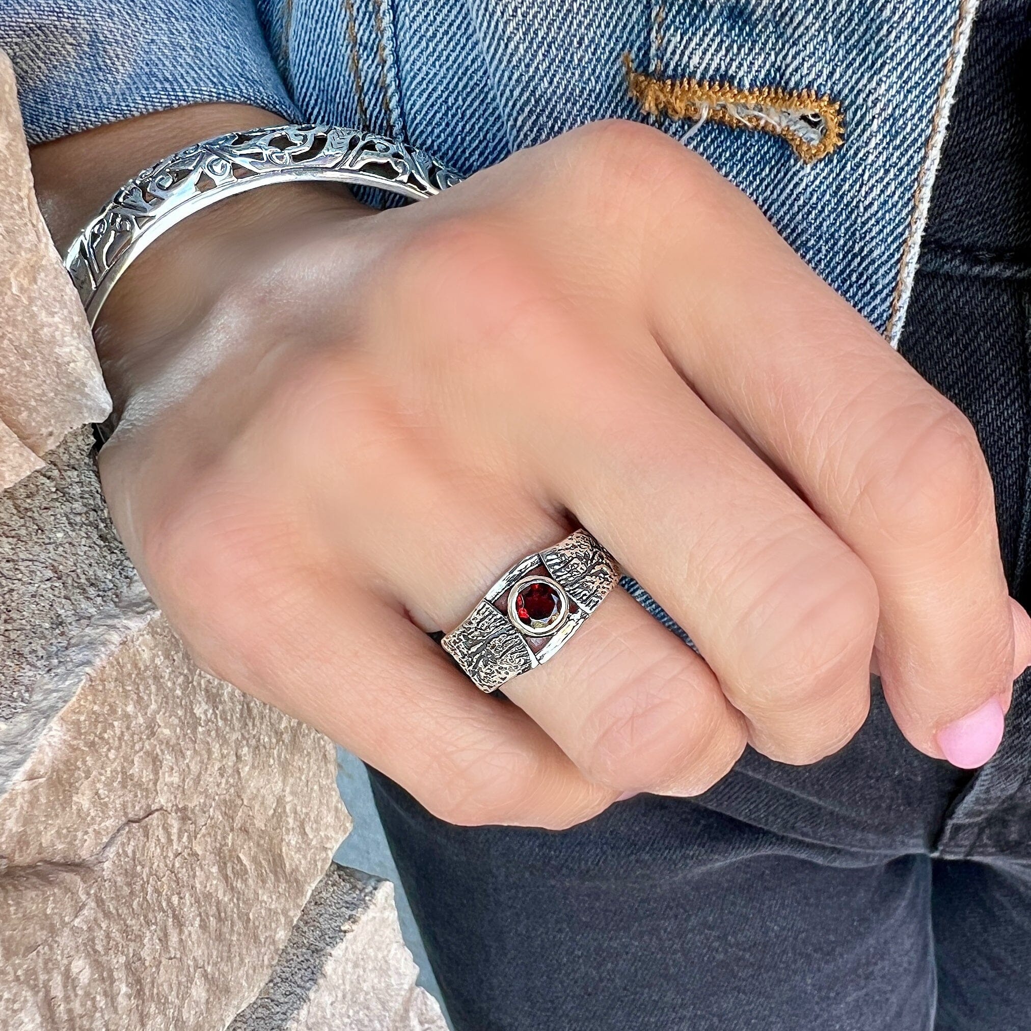 oxidized silver ring featuring a natural garnet stone