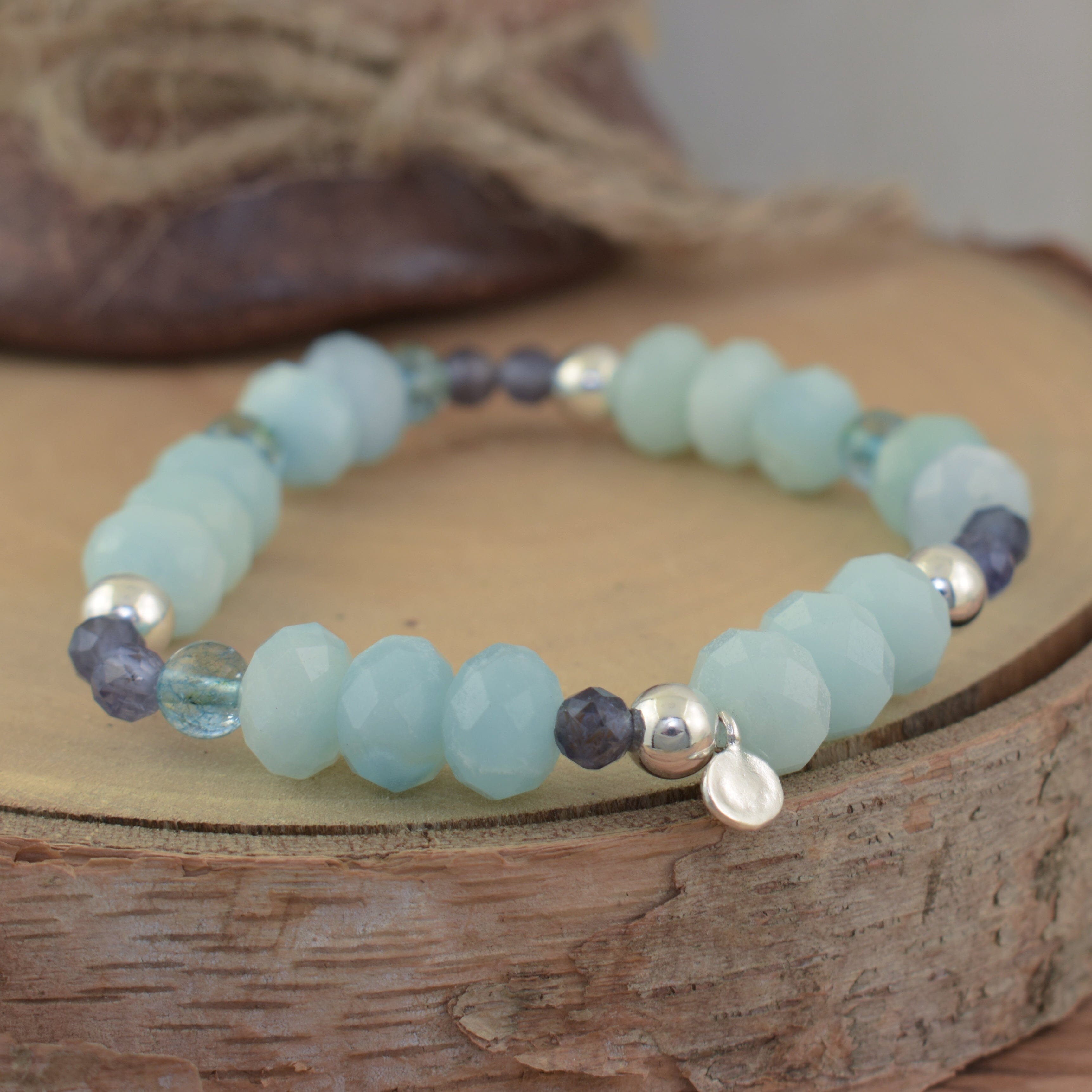 stretch bracelet featuring silver beads and Lolite, Cordorite, and Amazonite gemstones