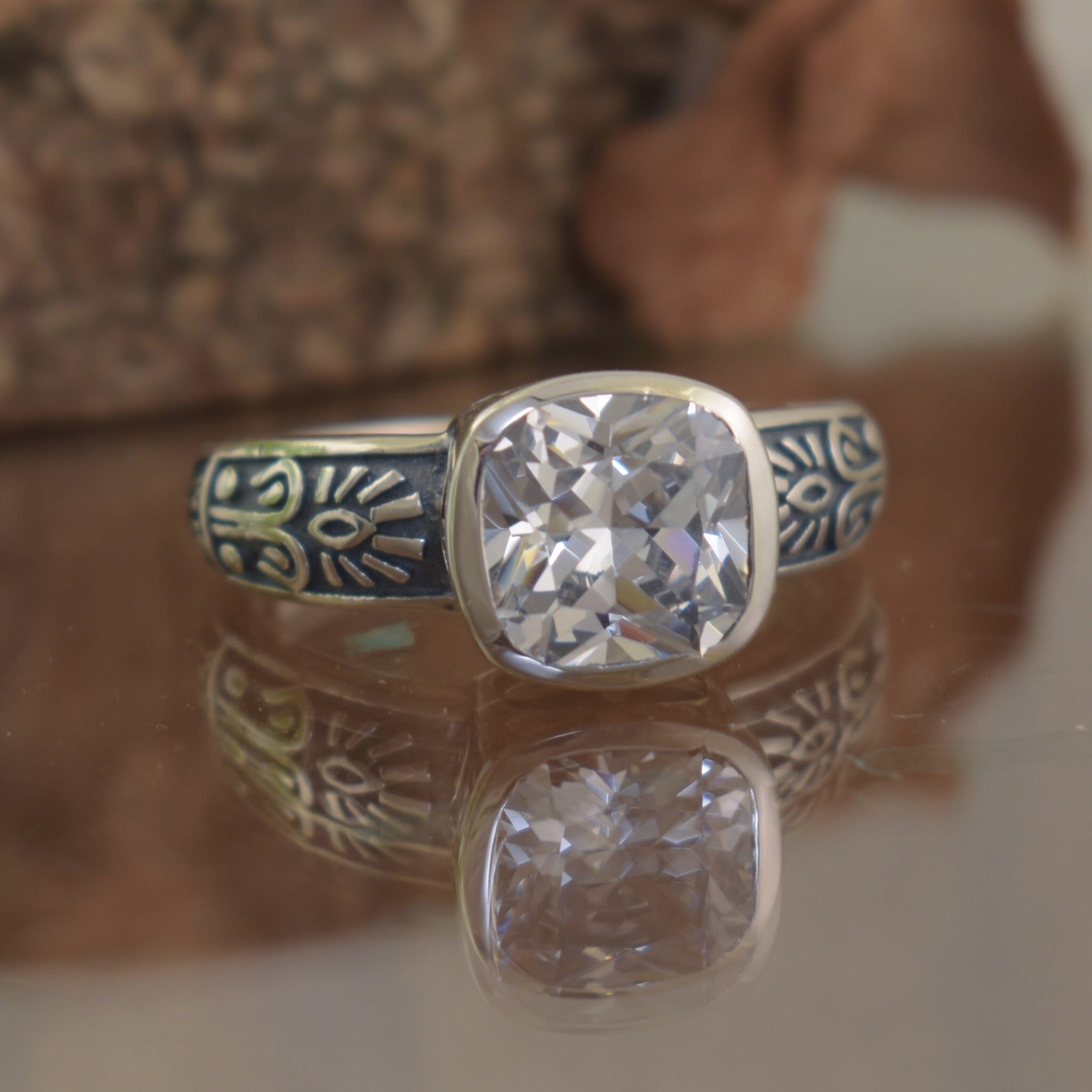 cz silver ring with intricate, artistic details