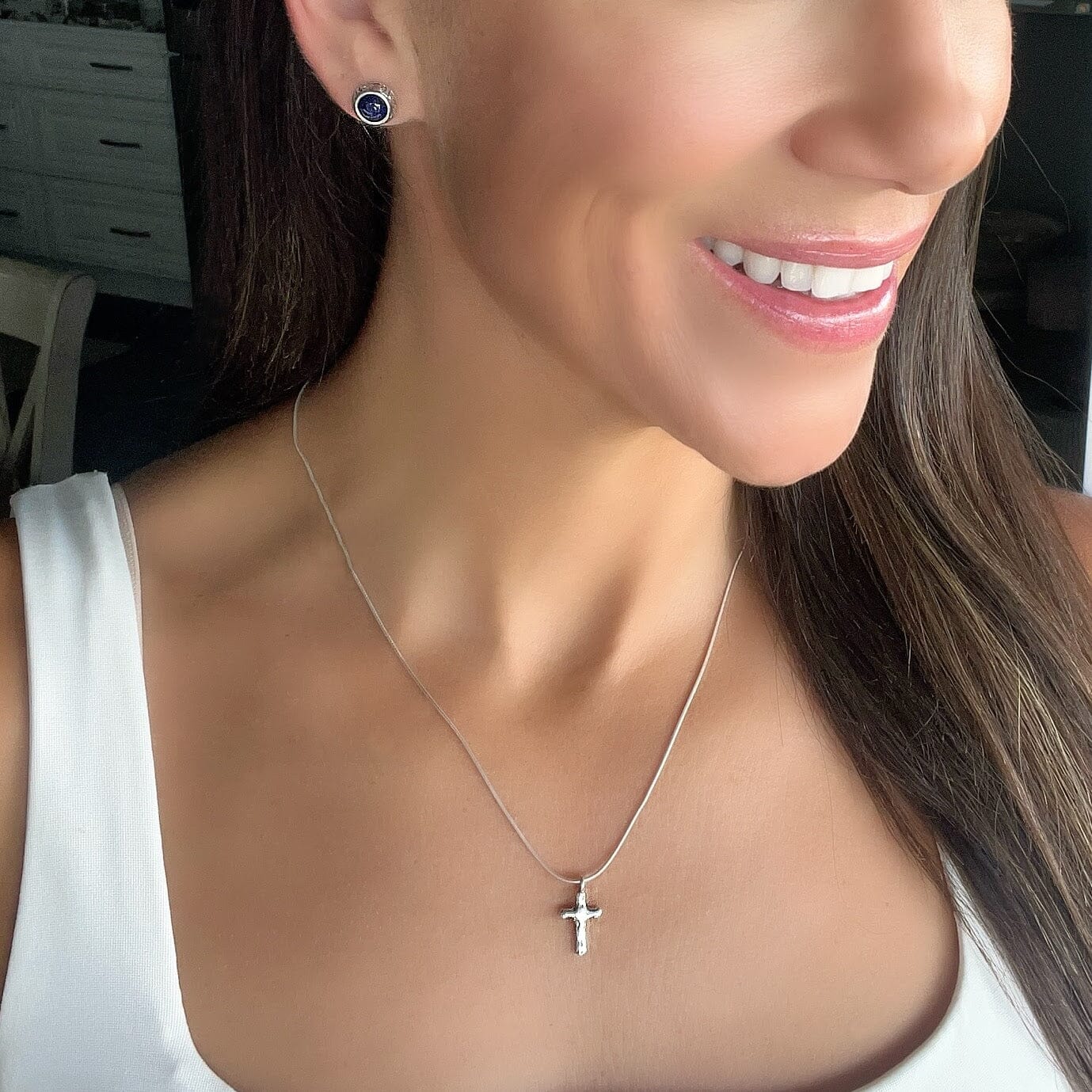 dainty organic style cross on a sleek silver chain