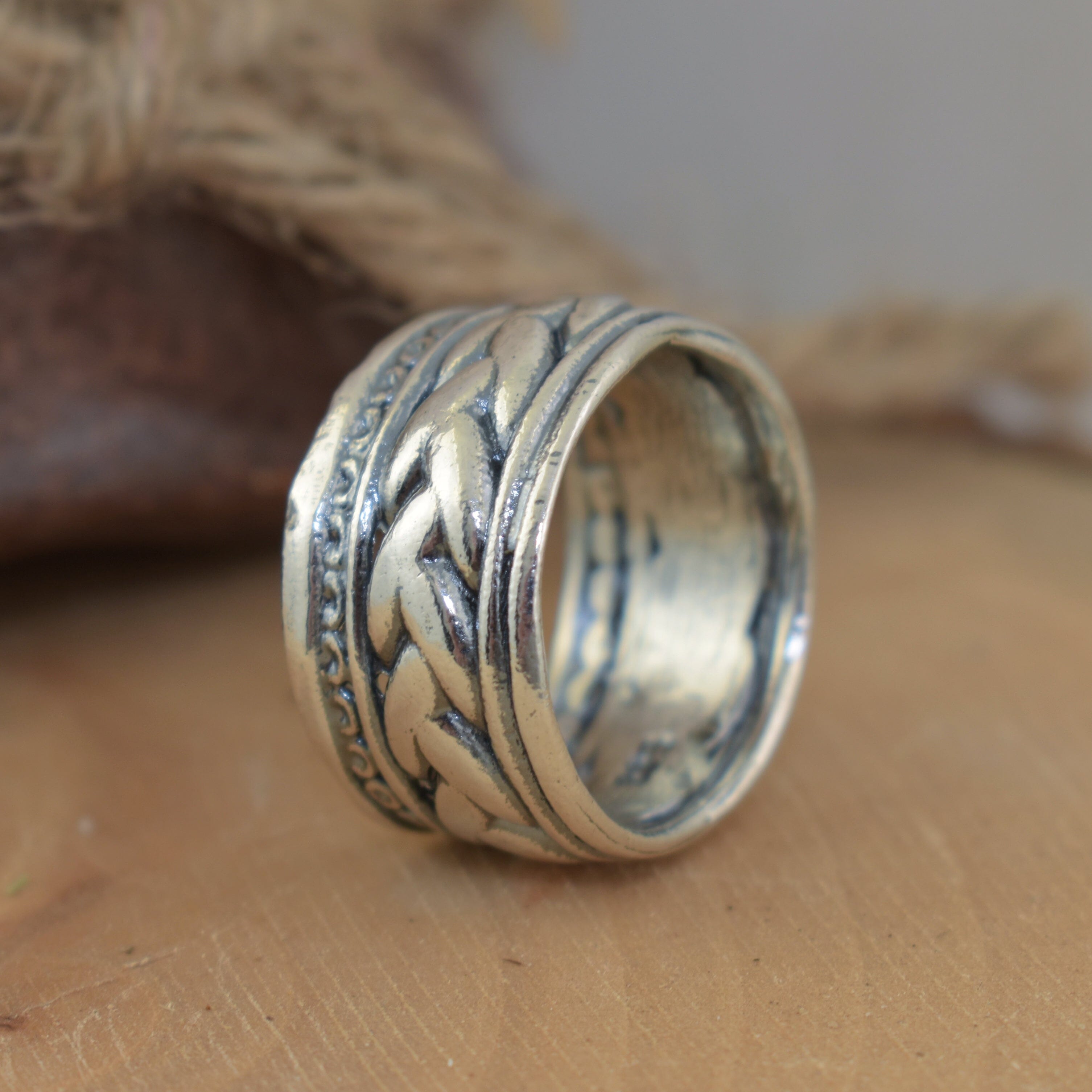 wide silver Weavers Ring with a high-polished and oxidized finish