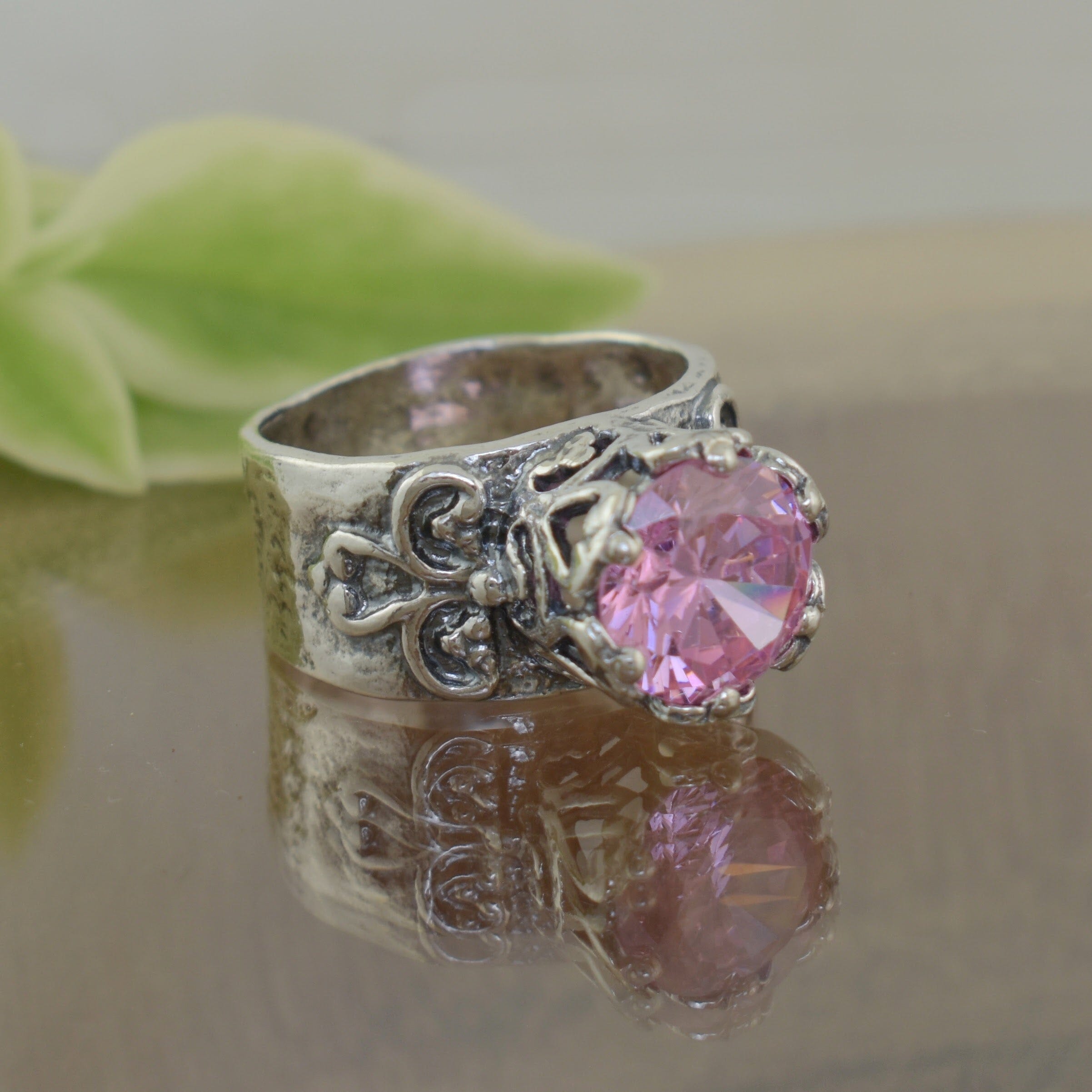 Pink Cinderella ring with unique band and pink stone