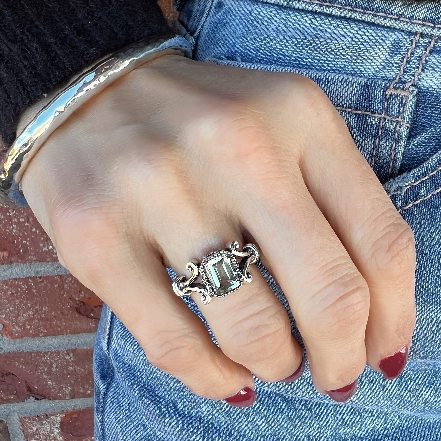 vintage sterling silver ring with a soft green emerald cut stone