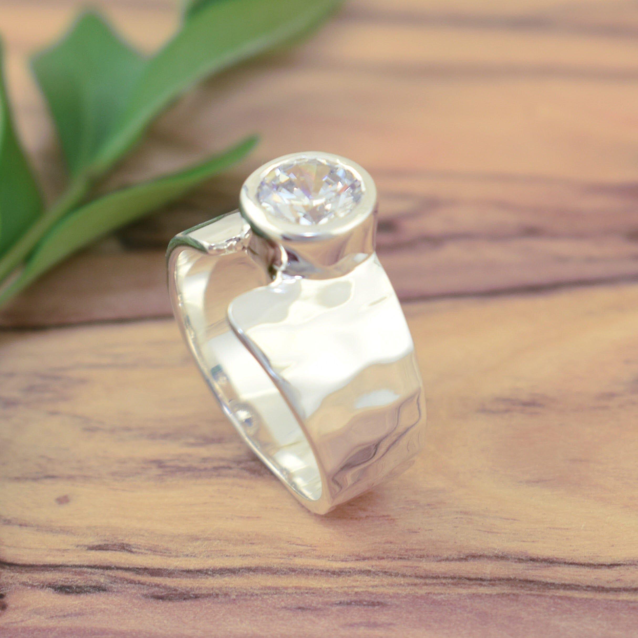 slightly hammered cz ring with round bezel