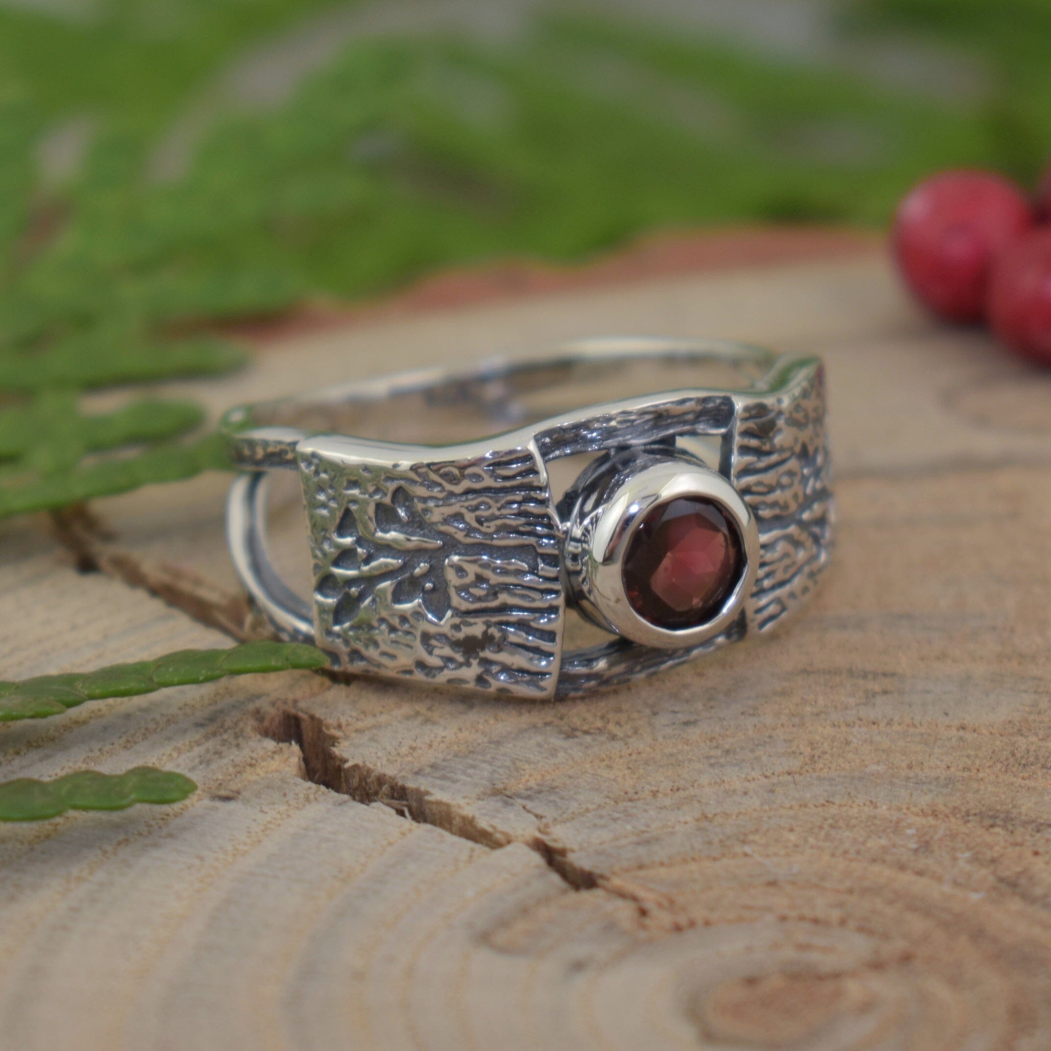 .925 sterling silver ring featuring deep red garnet stone