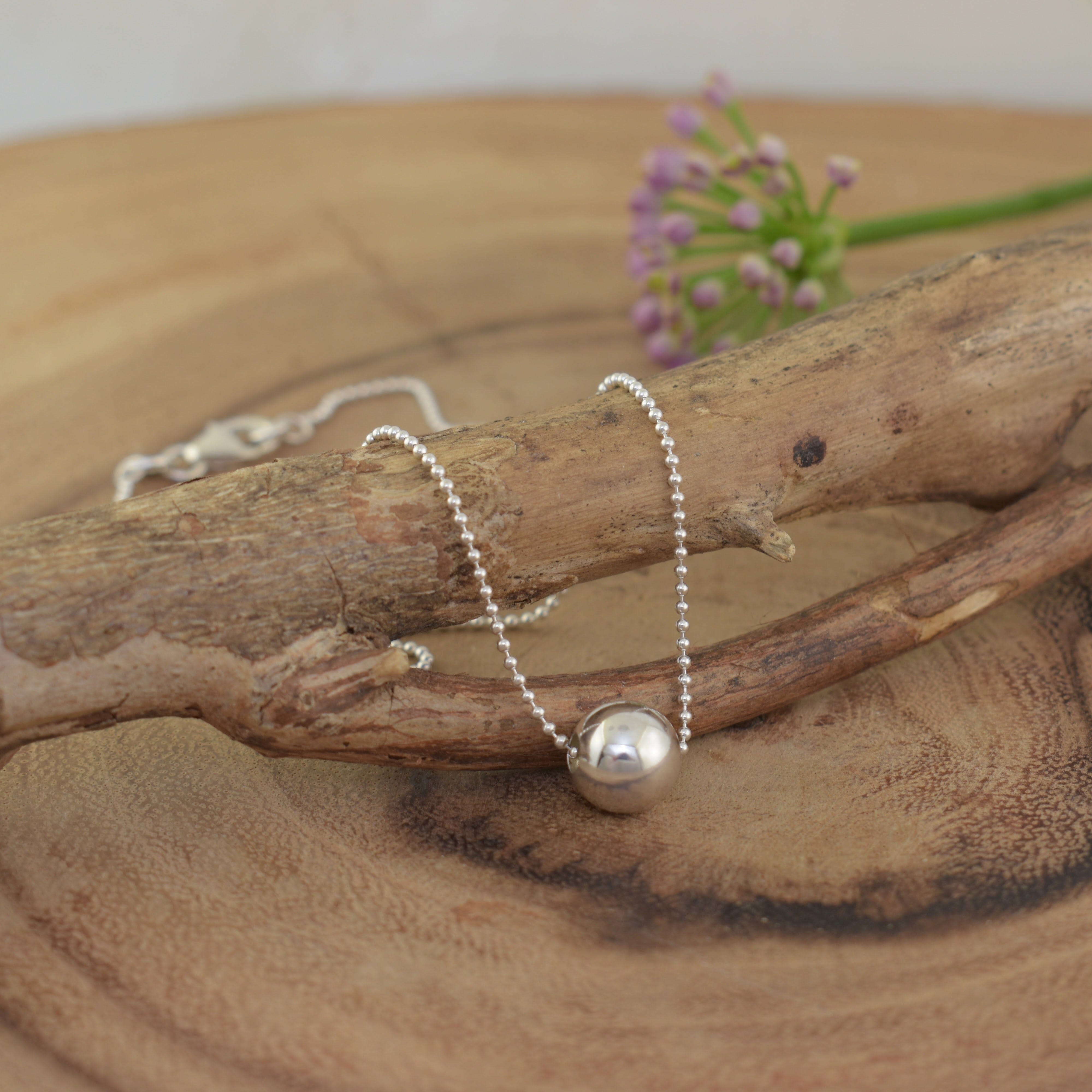 delicate bead chain with a silver polished bead pendant