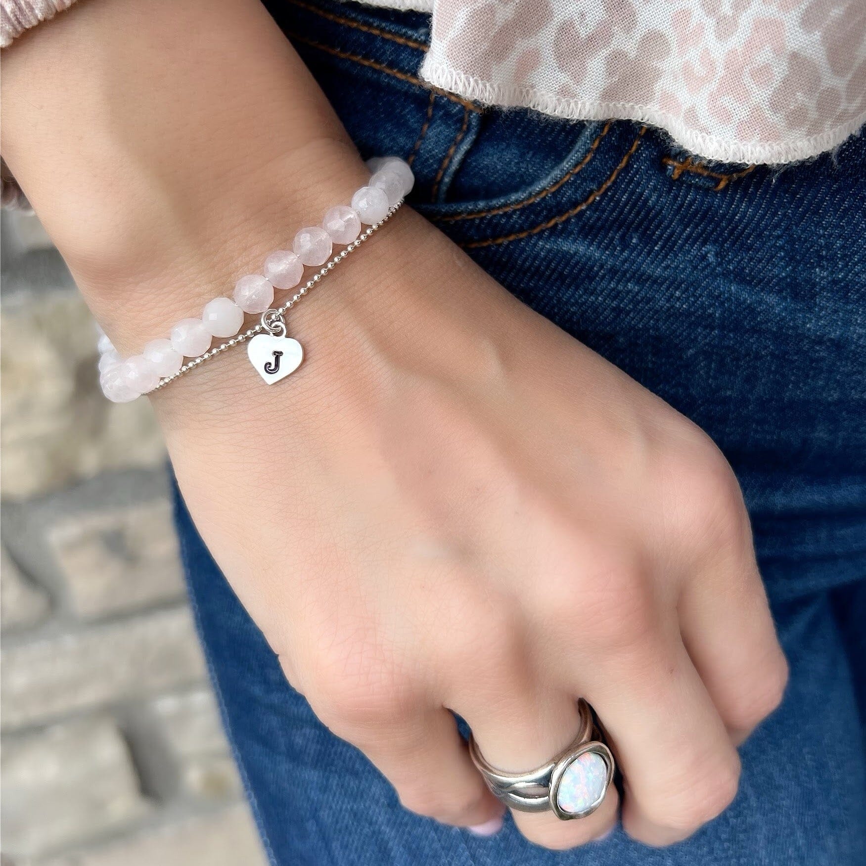 Sweet Thing personalized bracelet layered with Put'n on the Glitz Bracelet in rose quartz