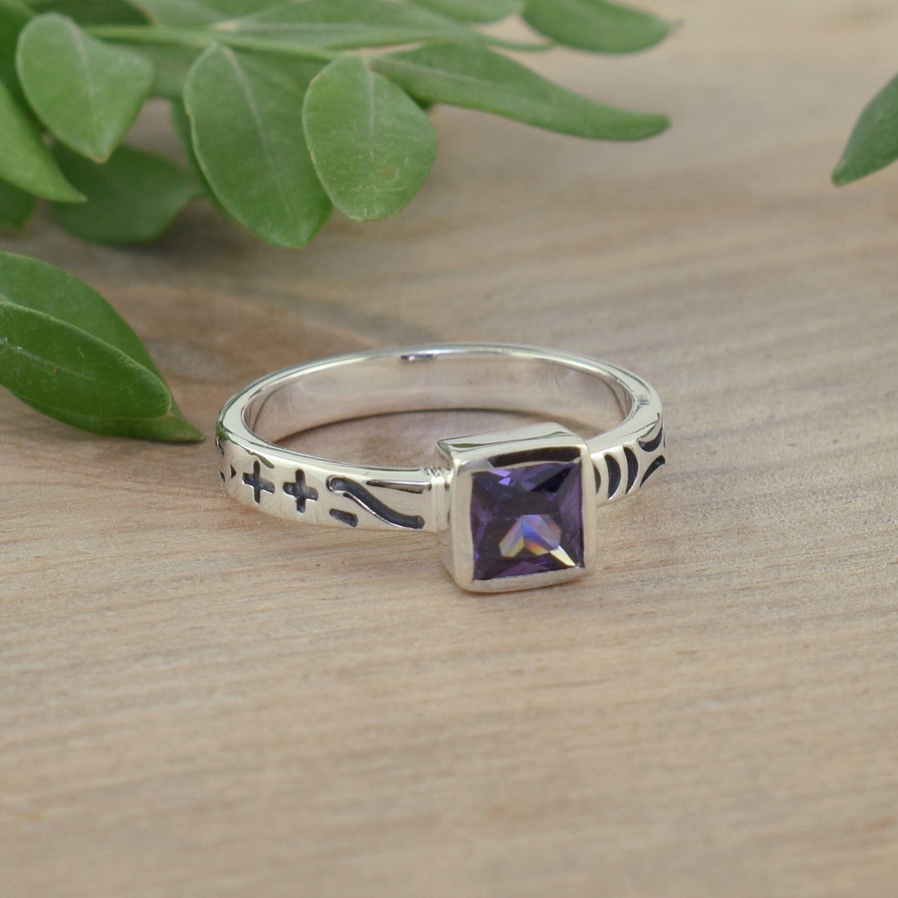 dainty .925 sterling silver ring featuring a princess-cut amethyst cz